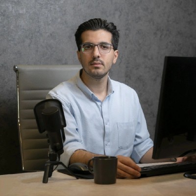 Pouria working at a desk